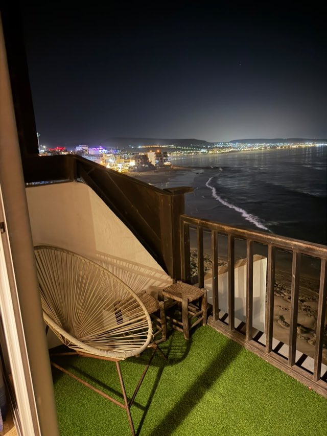 Apartment balcony over the beach at night