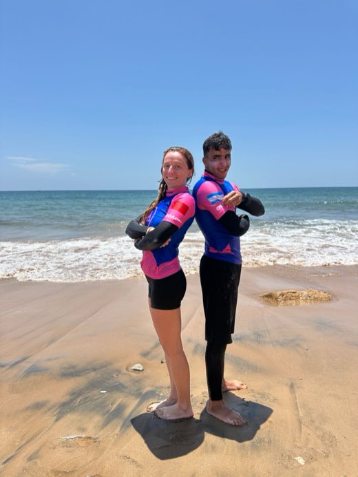 Two AP Surftrips coaches back to back on the beach