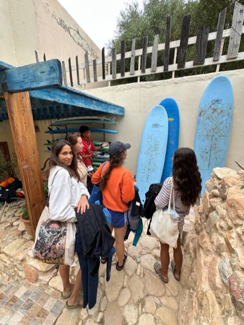 Guests picking boards from the villa board storage